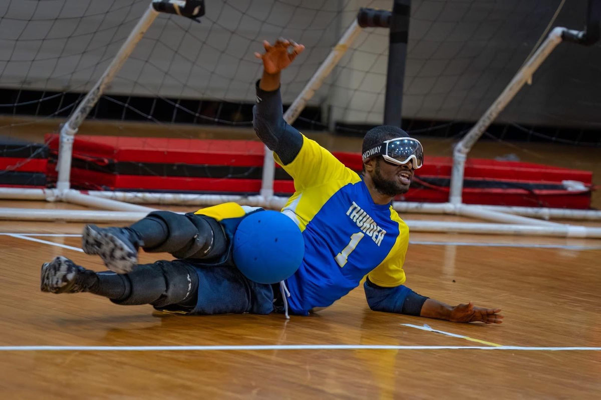 Kevin diving to stop the ball in his Thunder goalball jersey at the 2025 Goalball Nationals in Colorado Springs.